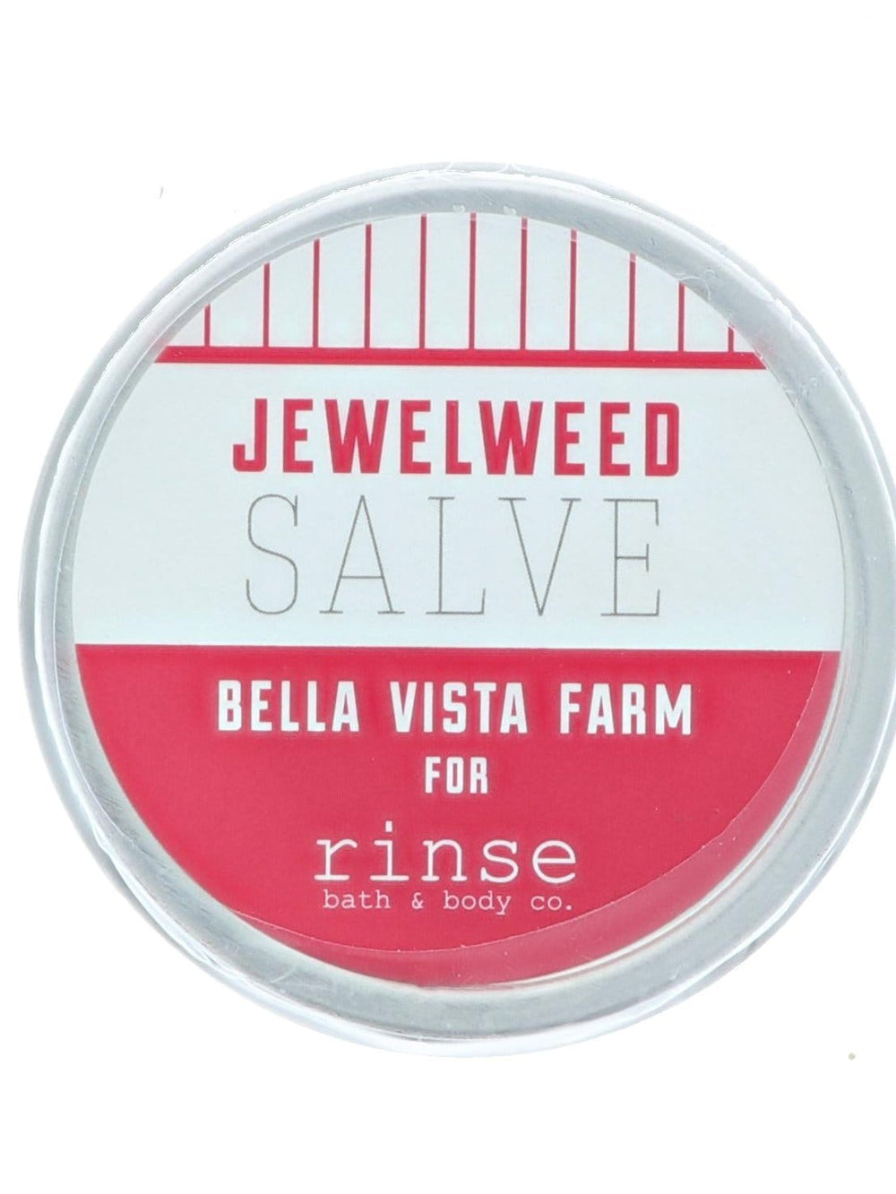 Jewelweed Salve tin lid close-up — coral pinstripe band on stark white