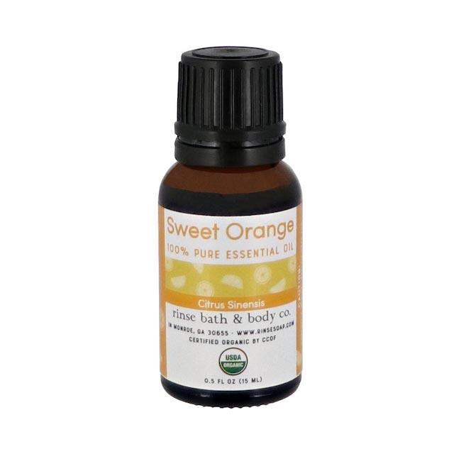 Sweet Orange essential oil bottle facing forward on seamless gray — black dropper cap in bright studio light