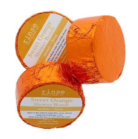 Three orange-foil Sweet Orange Shower Bombs cluster — crinkled metallic wrap on white