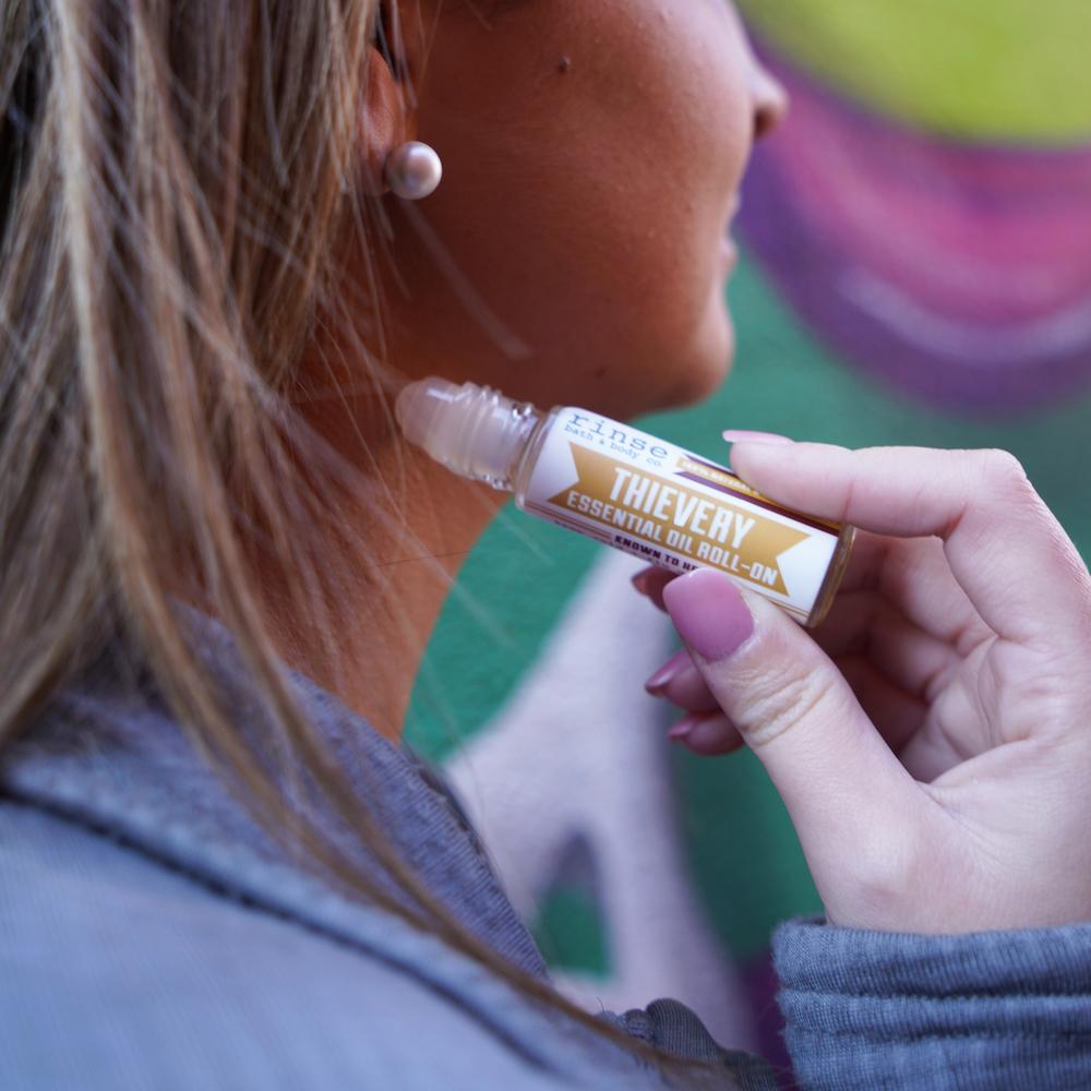 Thievery Essential Oil Roll-On in use — Rinse Bath & Body Co.