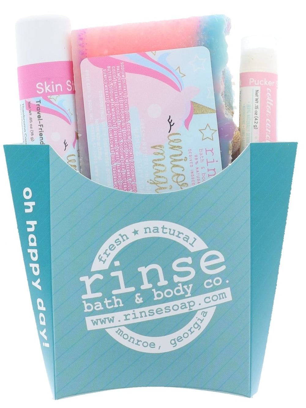 The Unicorn Magic kids gift set in its aqua carton — swirled unicorn bar soap, solid lotion skin stick and lip balm. Rinse Bath & Body Co.